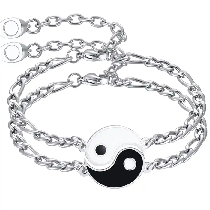 Yin en Yang pararmbanden in roestvrij staal.